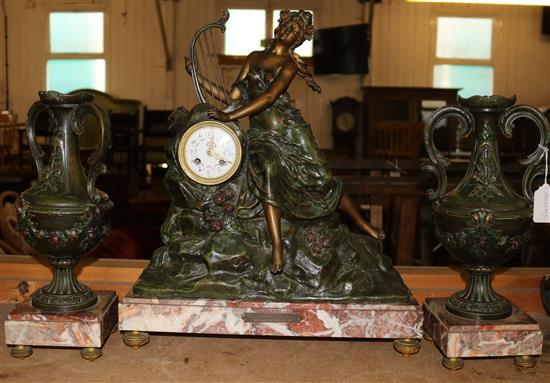French Art Nouveau figural clock garniture on rose marble base